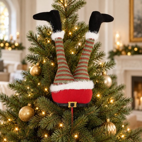 Gambe di Babbo Natale decorative che spuntano dall’albero di Natale